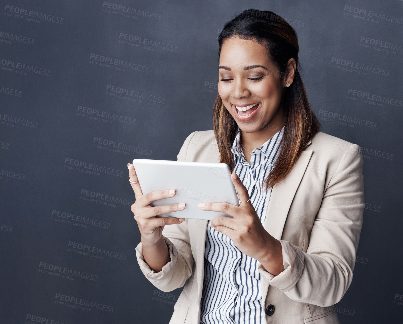 Buy stock photo Business woman, tablet and happy in studio for notification, texting and good news by dark background. Person, touchscreen and surprise with application for web chat, networking and social media