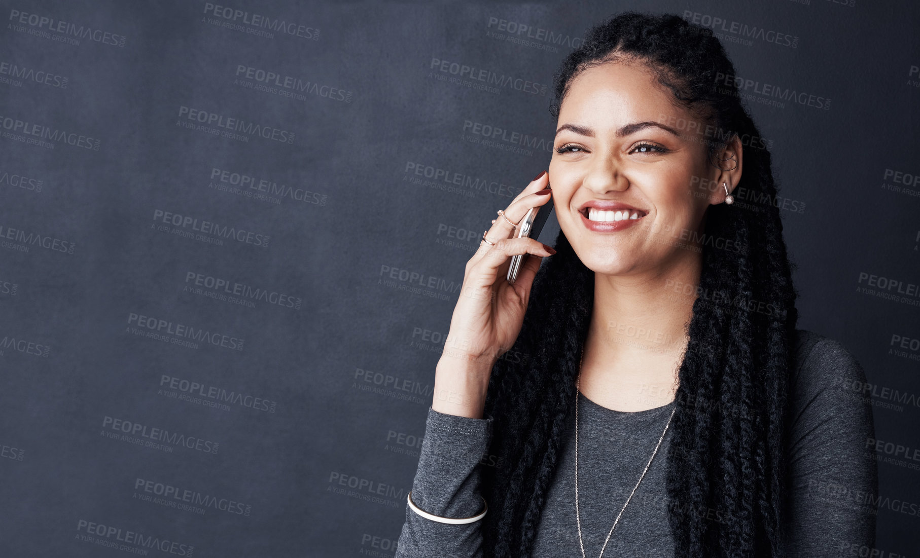 Buy stock photo Phone call, mockup space and African woman in studio for contact, online chat and social networking. Happy, smile and person on cellphone for talking, communication or conversation on dark background