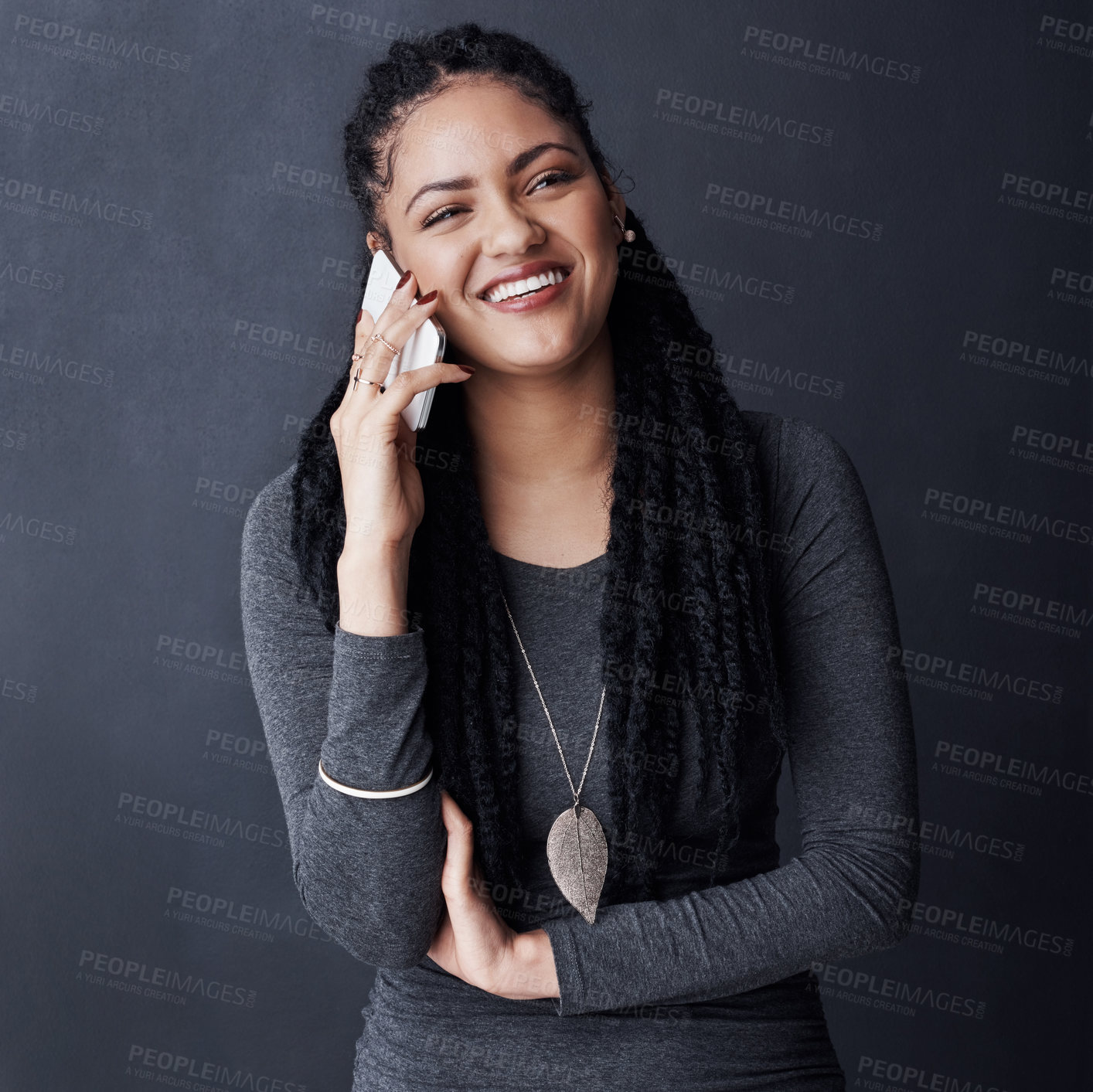 Buy stock photo Phone call, laughing and African woman in studio for contact, online chat and social networking. Happy, communication and isolated person on smartphone for funny conversation on dark background