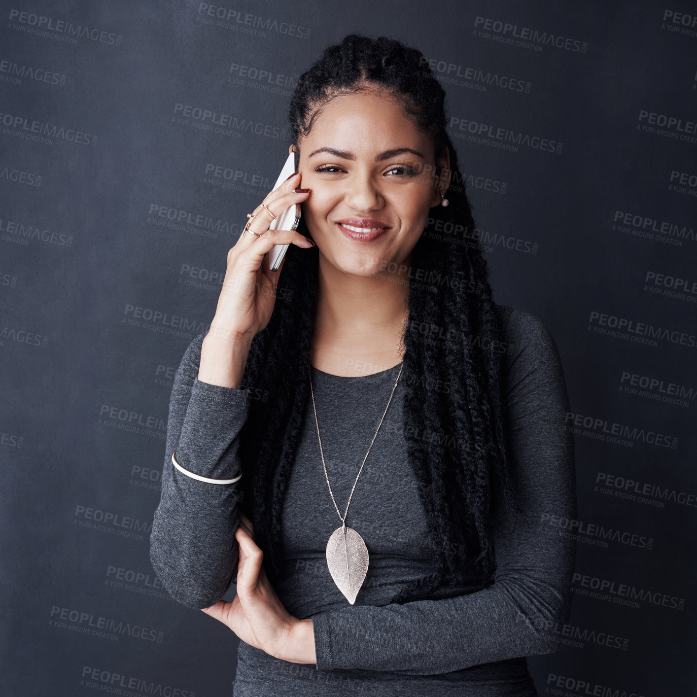 Buy stock photo Phone call, portrait and African woman in studio for contact, online chat and social networking. Happy, communication and person on smartphone for talking, gossip and conversation on dark background