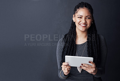 Buy stock photo Happy woman, portrait and business with tablet on space for research, network or connectivity on a gray studio background. Female person, user or model with smile or technology for app on mockup