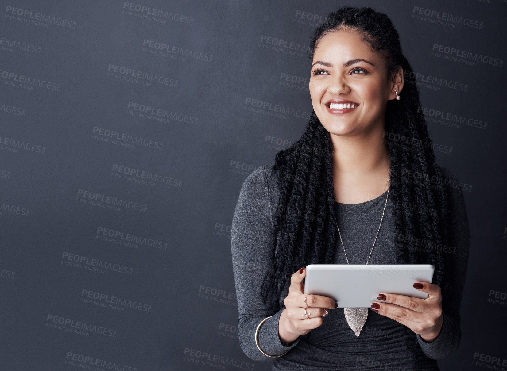 Buy stock photo Happy woman, thinking and business vision with tablet on space for solution, plan or ideas on a gray studio background. Female person, user or model with smile or technology for app design on mockup