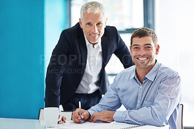 Buy stock photo Cropped portrait of two businessmen working together in the office