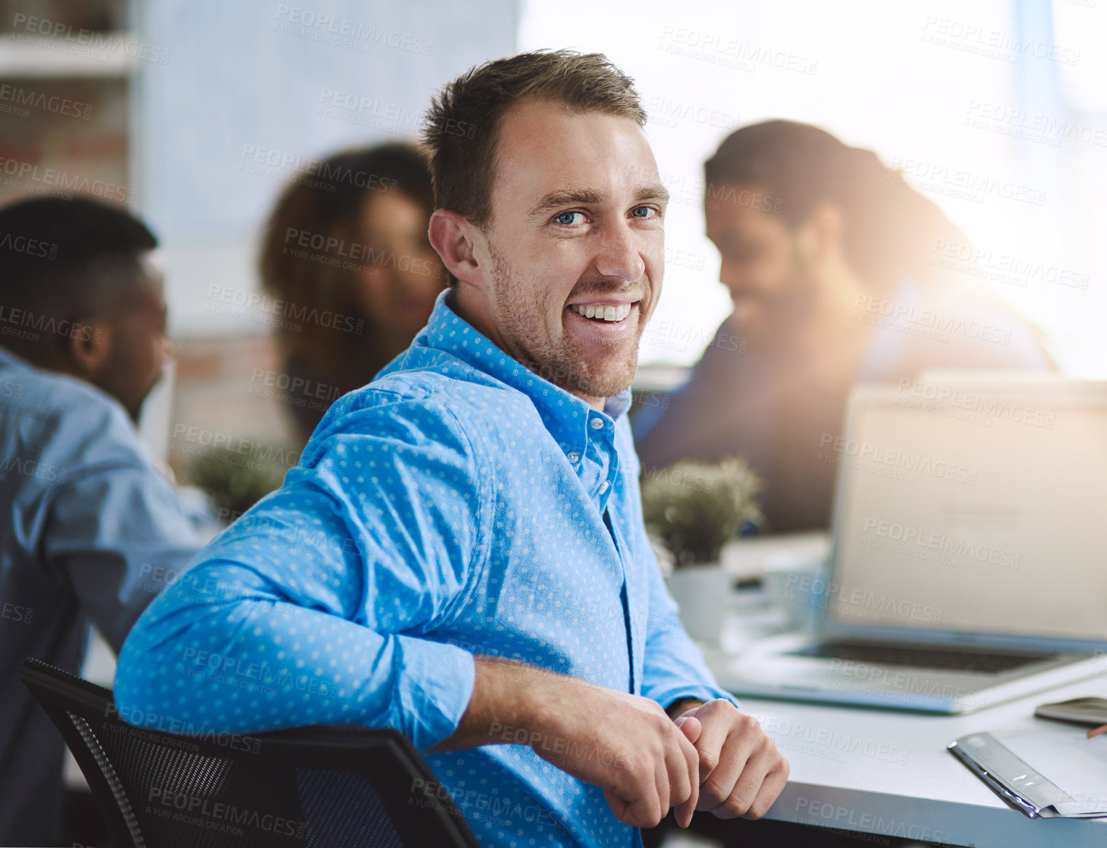 Buy stock photo Happy, portrait and businessman in meeting for planning, brainstorming and lens flare in office. Face, collaboration or proud designer with smile for creative agency or discussion in startup workshop