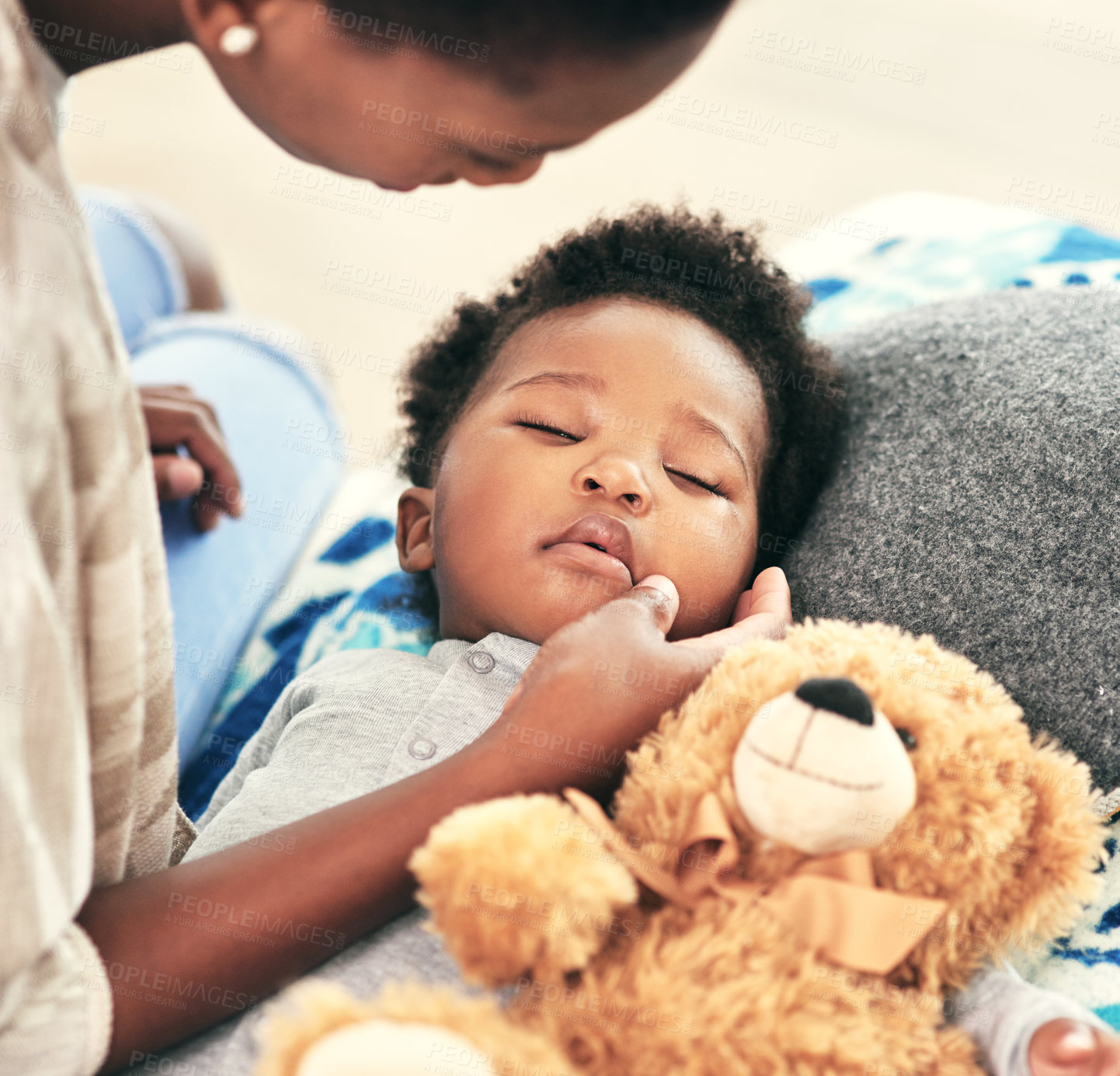 Buy stock photo Tired, kid and sleeping with teddy bear on bed for child development, comfortable and peace. Black family, baby and hand of mother with dreaming in nursery for resting, growth and calm at home