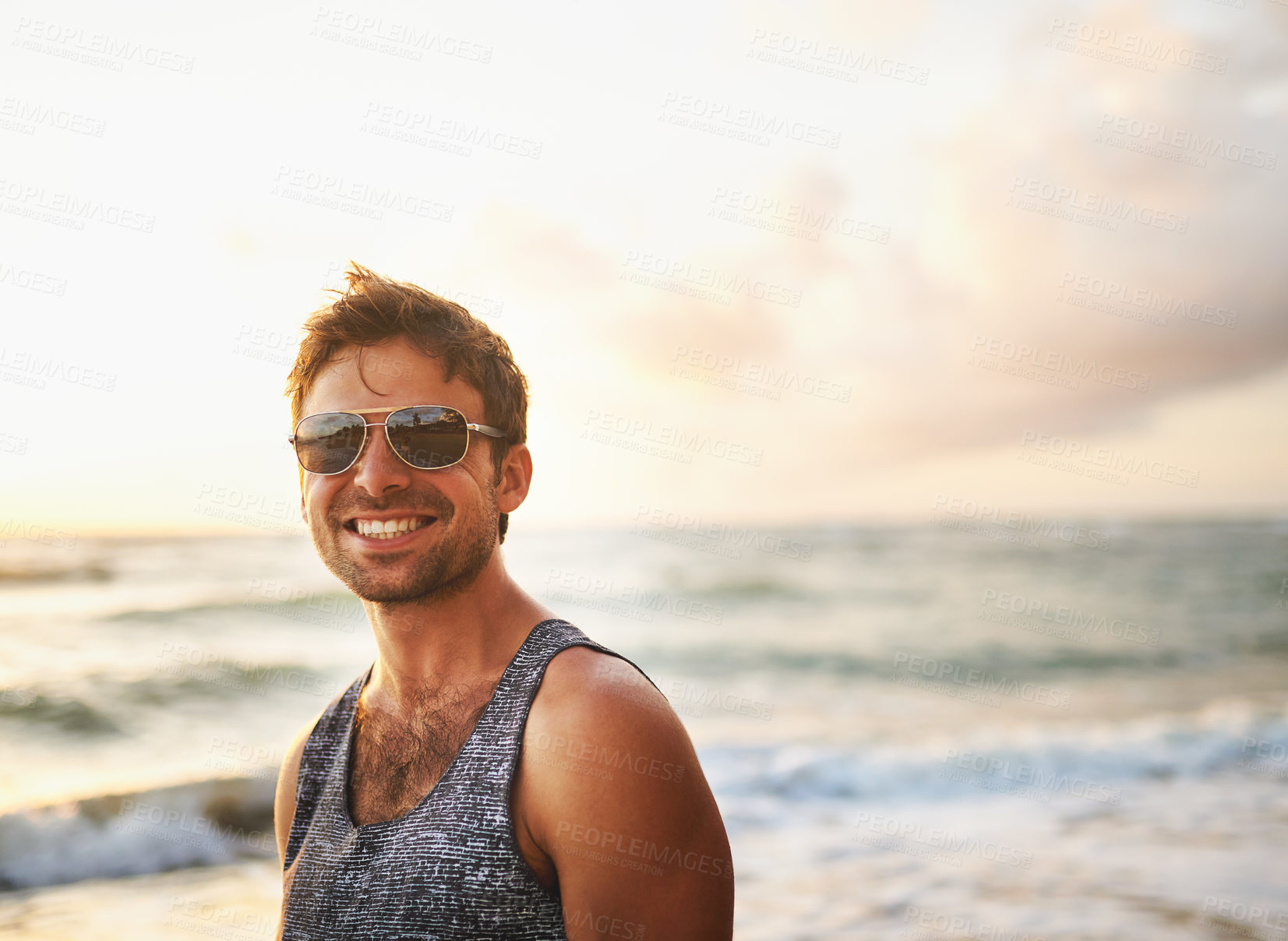 Buy stock photo Travel, beach and man with sunglasses by water for outdoor vacation, adventure and peace on tropical island. Sea, waves and male person in nature with smile for holiday, journey and tourism in Bali