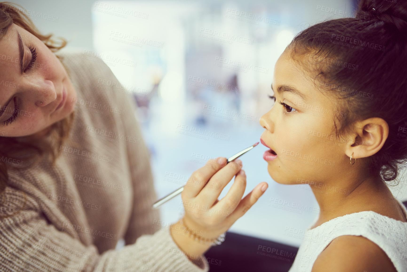 Buy stock photo Backstage, child model or makeup with girl and stylist in studio, getting ready behind the scenes. Celebrity, cosmetics and lipstick with woman on set for beauty or creative preparation of talent