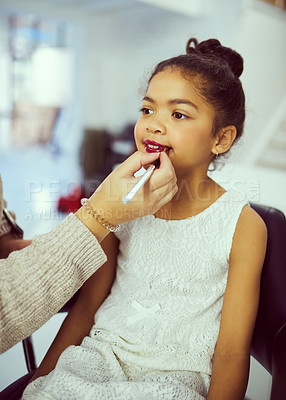 Buy stock photo Backstage, pageant or makeup with girl and stylist in studio, getting ready behind the scenes. Child model, cosmetics and lipstick with woman on set for creative preparation of celebrity talent