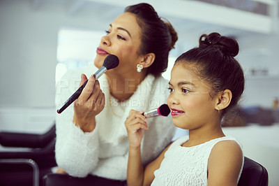 Buy stock photo Backstage, beauty pageant or makeup with girl and stylist in studio, getting ready behind the scenes. Child model, cosmetics and blusher brush with woman on set for preparation of celebrity talent