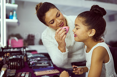 Buy stock photo Backstage, celebrity or makeup with happy girl and stylist in studio, getting ready behind the scenes. Child model, cosmetics and foundation with woman on set for creative preparation of talent