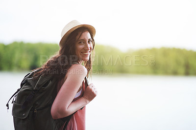Buy stock photo Portrait of a young woman admiring the view while out on a hike
