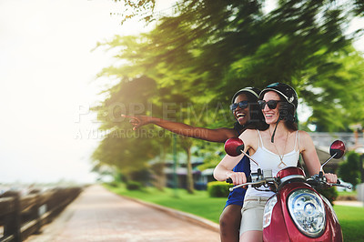 Buy stock photo Shot of two friends enjoying a ride on a scooter together