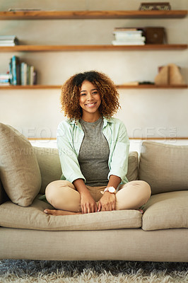 Buy stock photo Full length portrait of an attractive young woman sitting on her sofa at home