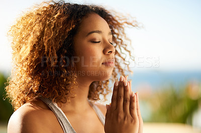 Buy stock photo Cropped shot of an attractive young woman meditating outdoors