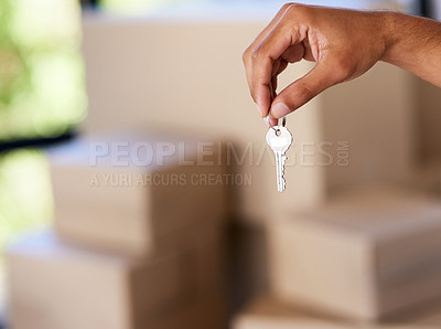 Buy stock photo Shot of an unidentifiable man holding up his house key on moving day