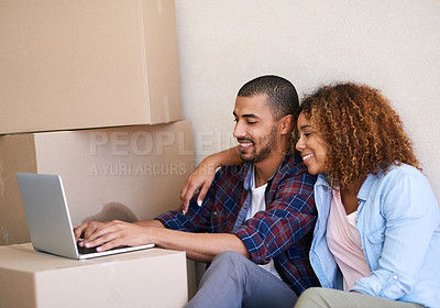 Buy stock photo New home, boxes and couple with laptop, smile and property with real estate, cardboard and goals. People, apartment and man with woman, internet or computer to pay mortgage, rent and bonding together