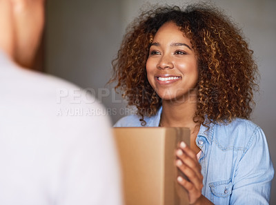 Buy stock photo Cropped shot of a woman receiving her package from the delivery man