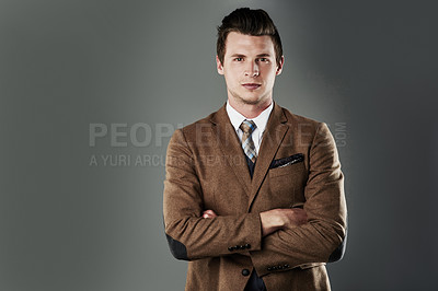 Buy stock photo Cropped shot of a young businessman posing against a grey background