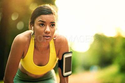 Buy stock photo Shot of a sporty young woman outdoors