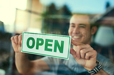 Buy stock photo Cropped shot of a young man hanging the 