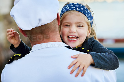 Buy stock photo Rearview shot of a father in a navy uniform hugging his happy little girl