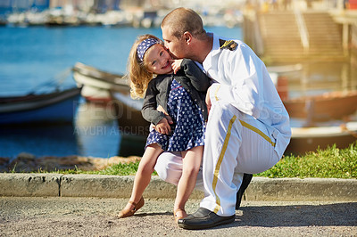 Buy stock photo Portrait of a father in a navy uniform posing with his little girl on the dock