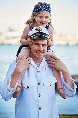 Buy stock photo Portrait of a father in a navy uniform carrying his little girl on his shoulders