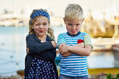 Buy stock photo Portrait of a cute little brother and sister posing together on a day out