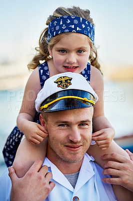 Buy stock photo Portrait of a father in a navy uniform carrying his little girl on his shoulders