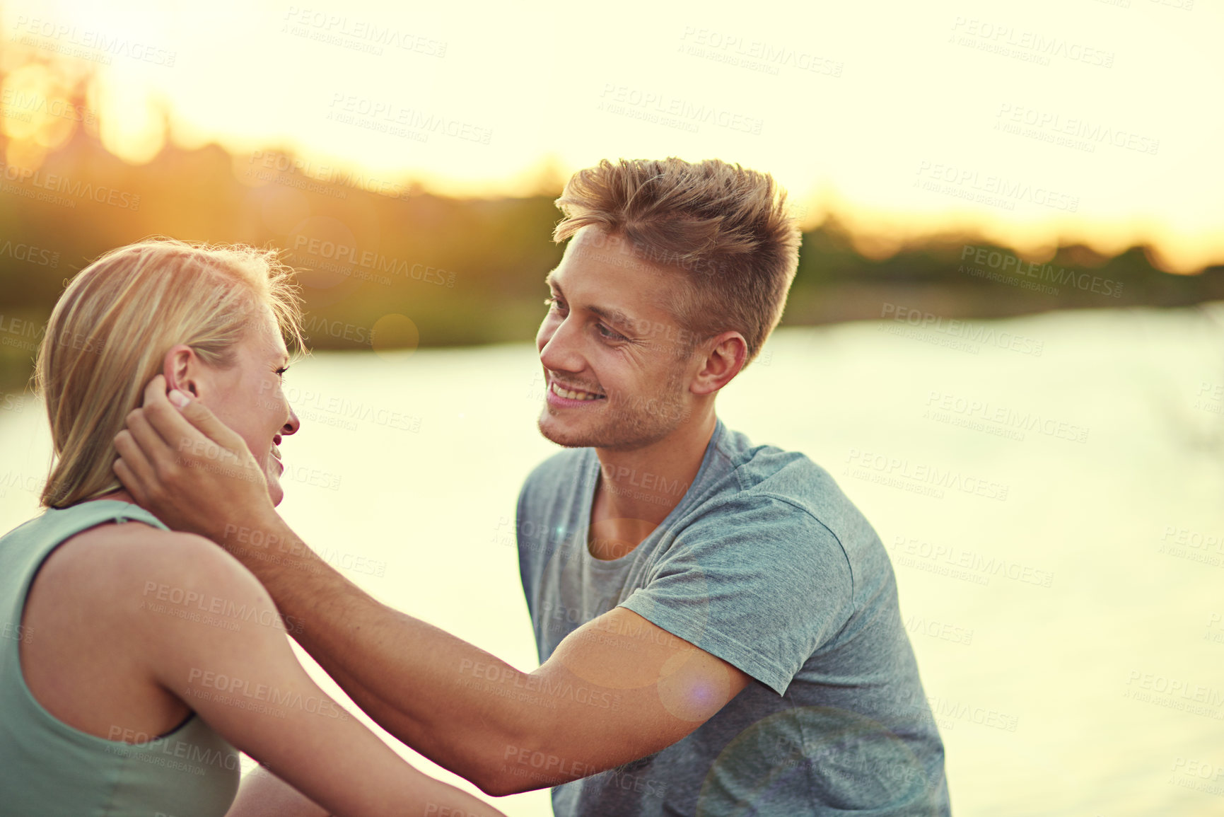 Buy stock photo Cropped shot of an affectionate young couple spending quality time together outside