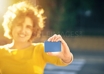 Buy stock photo Shot of an unrecognizable young woman holding a credit card