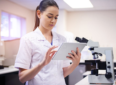 Buy stock photo Woman, scientist and online on tablet in laboratory for daily schedule, biotechnology and experiment for medical study or tests. Girl, digital technology and planning for pharmaceutical breakthrough.