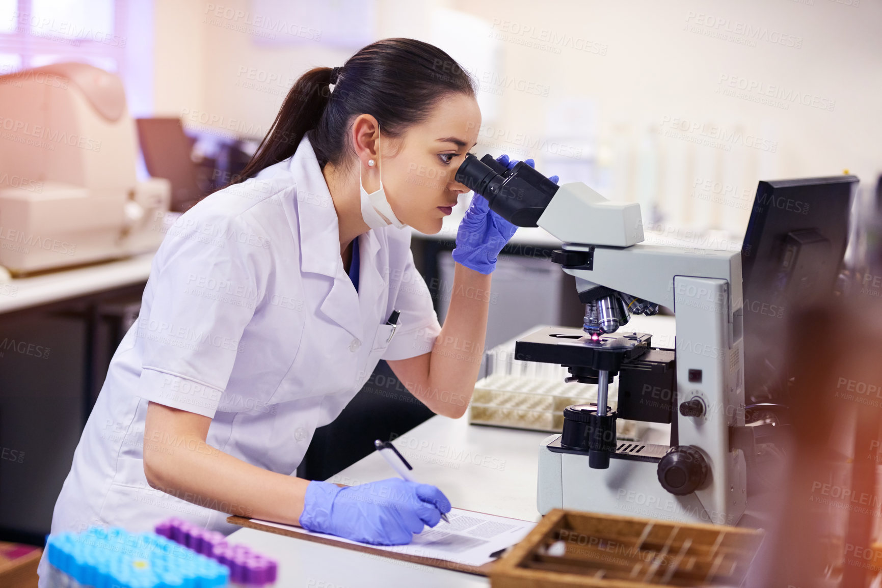 Buy stock photo Microscope, female scientist and analyse in laboratory for research or medical breakthrough. Notes, data and health with doctor or expert in microbiology with equipment for clinical trial in America.