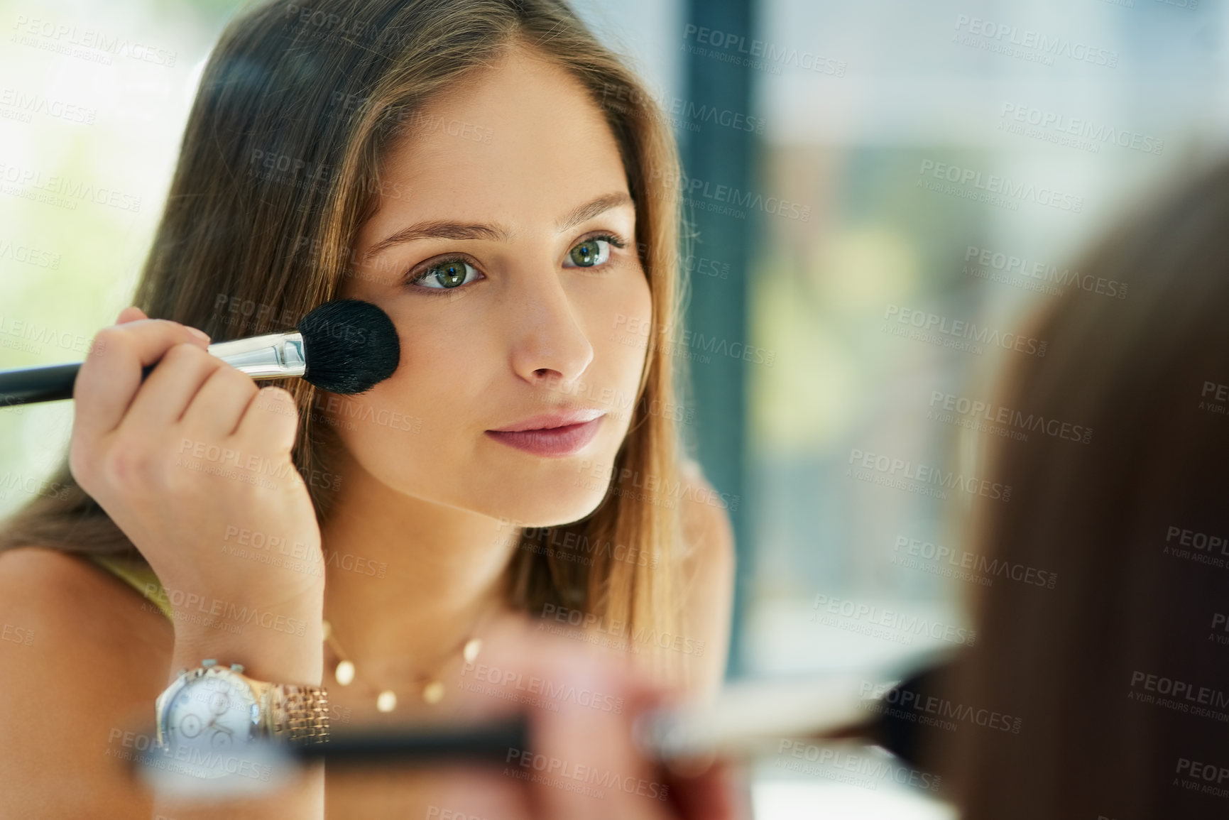 Buy stock photo Mirror, makeup and blusher with a woman in the bathroom to apply cosmetics to her face for beauty. Reflection, brush and morning routine with an attractive female person applying a cosmetic product
