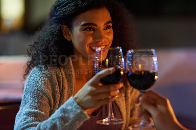 Buy stock photo Cropped shot of a young couple making a toast