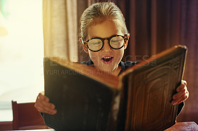 Buy stock photo Cropped shot of a little girl reading a magical book
