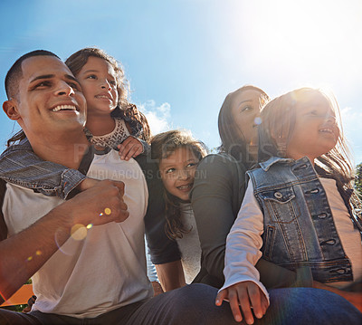 Buy stock photo Shot of a happy family spending time together outdoors