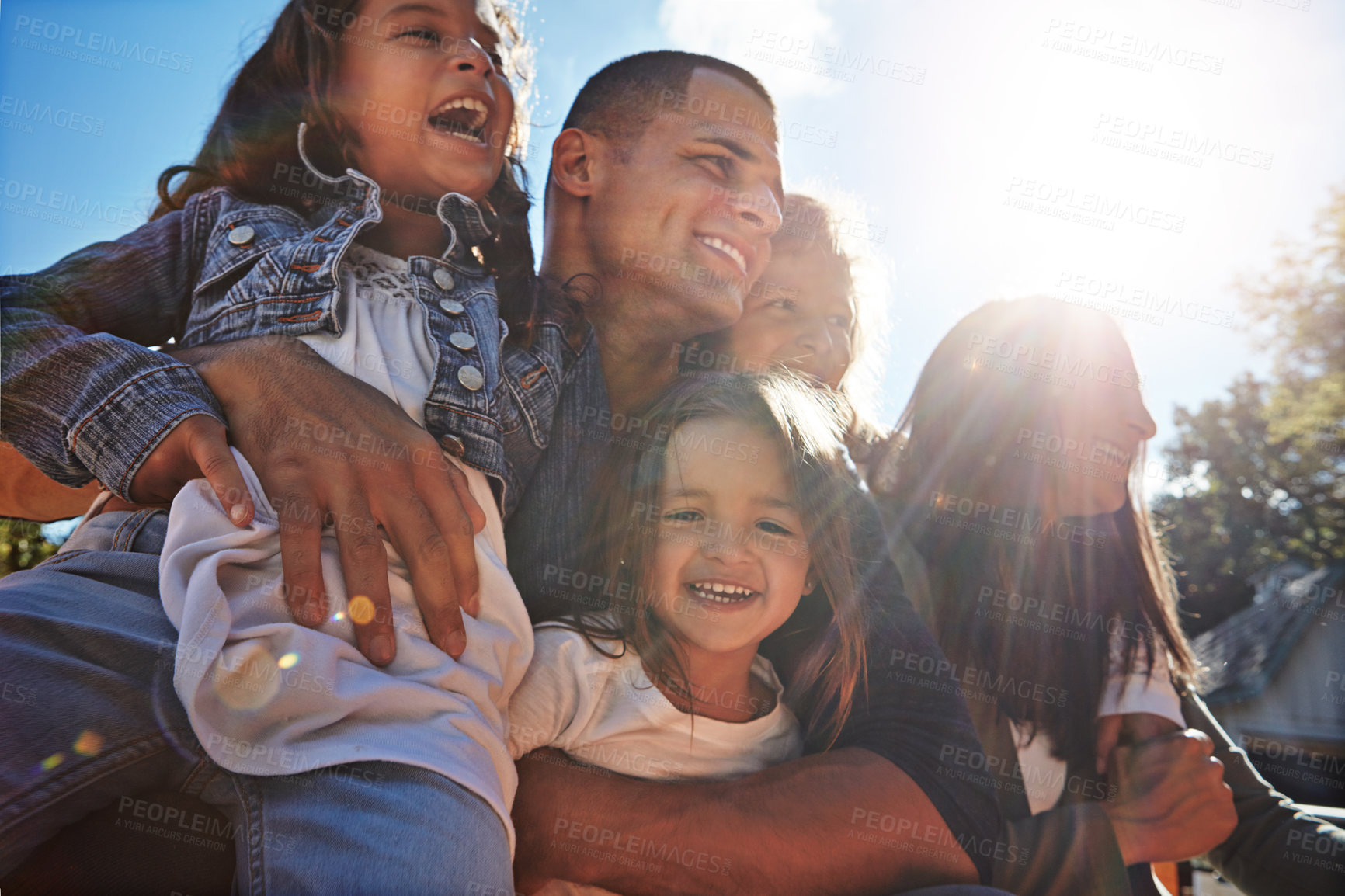 Buy stock photo Portrait of a happy family spending time together outdoors