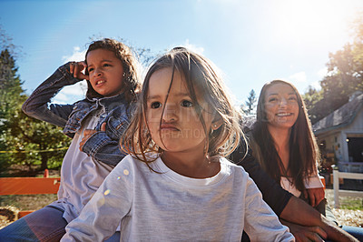 Buy stock photo Shot of a young family spending time together outdoors