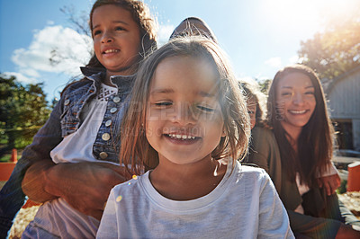 Buy stock photo Shot of a happy family spending time together outdoors