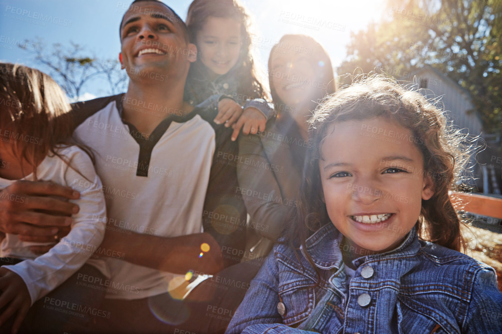 Buy stock photo Portrait of a happy family spending time together outdoors