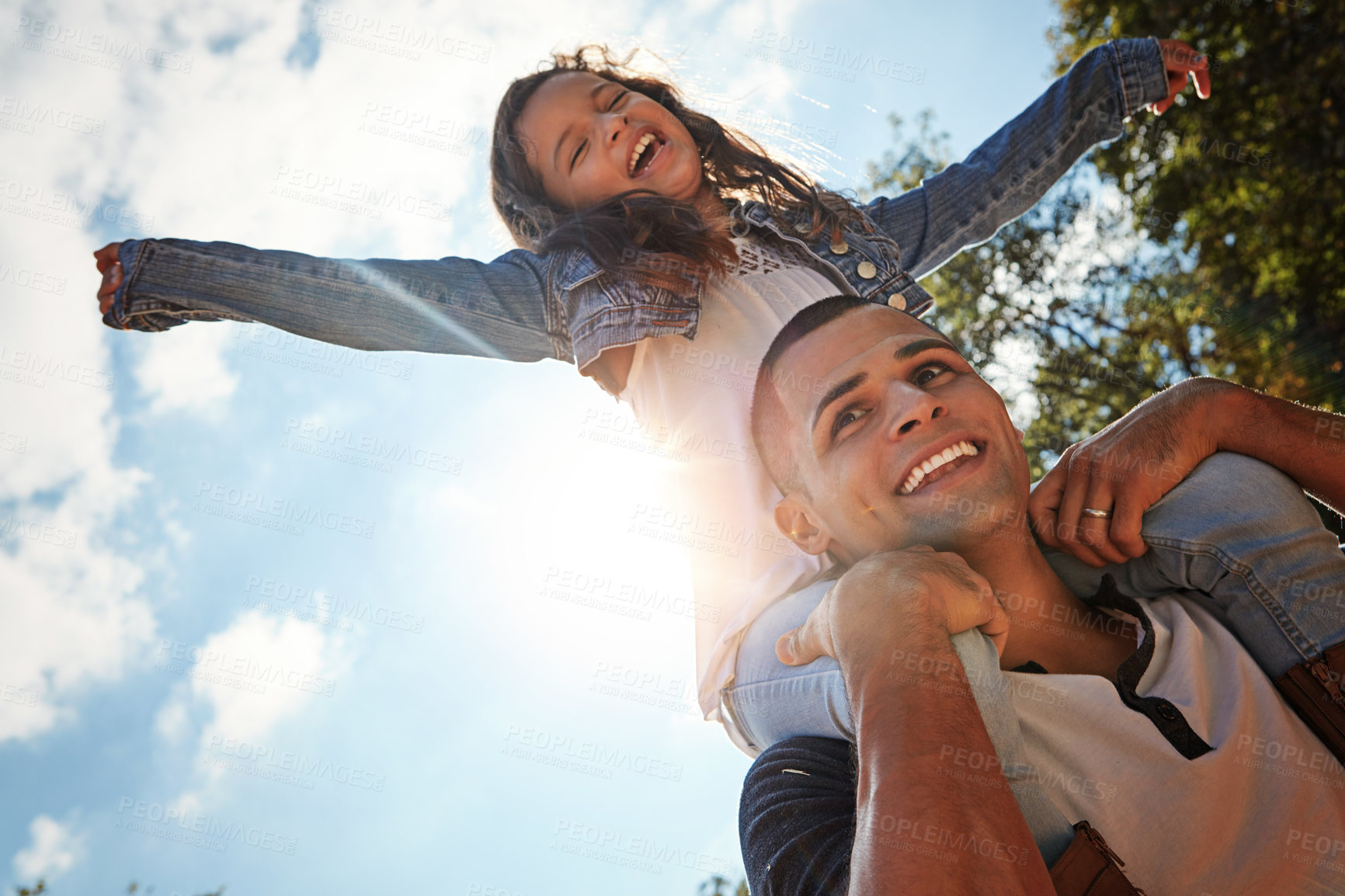 Buy stock photo Sky, freedom and dad with girl on shoulder in park for outdoor adventure, child development and support. Playful, smile and low angle of man with kid for happy bonding, love and care on fathers day