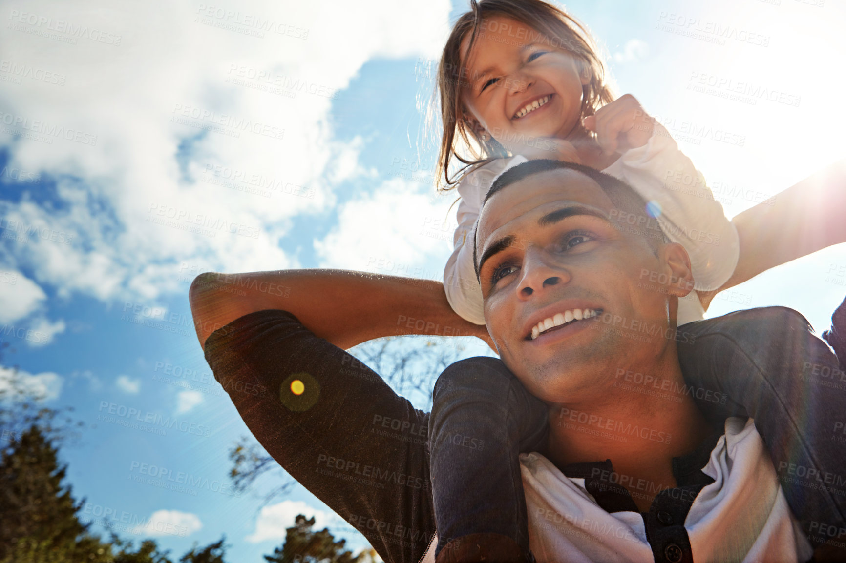 Buy stock photo Blue sky, smile and man with girl on shoulder in nature for outdoor adventure, care and child development. Playful, happy and low angle of dad with kid for fun bonding, love or support on fathers day