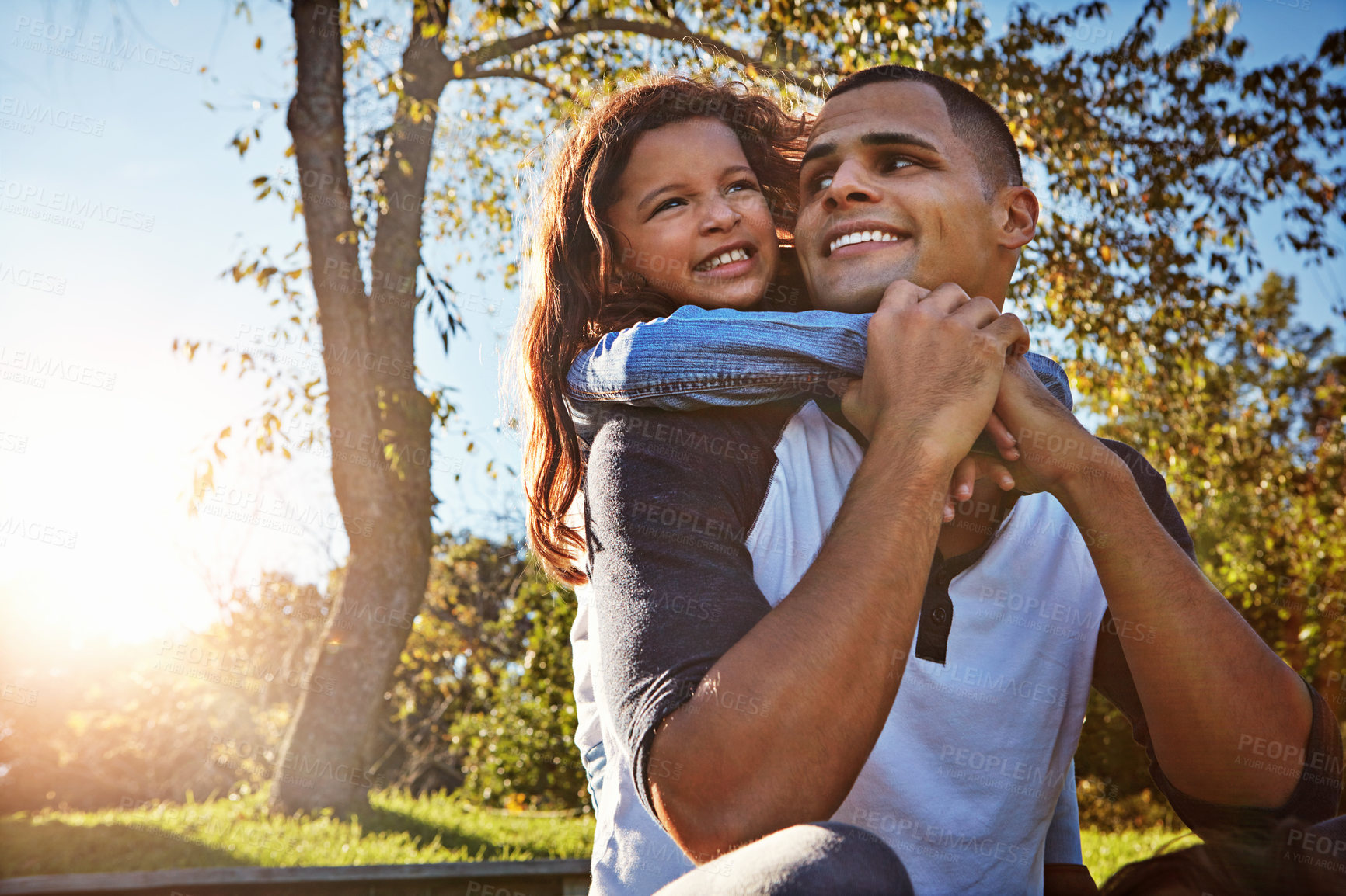 Buy stock photo Shot of a happy father and daughter spending time together outdoors