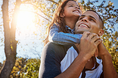 Buy stock photo Shot of a happy father and daughter spending time together outdoors