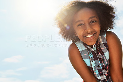 Buy stock photo Portrait of a happy girl standing outside on a bright summer’s day