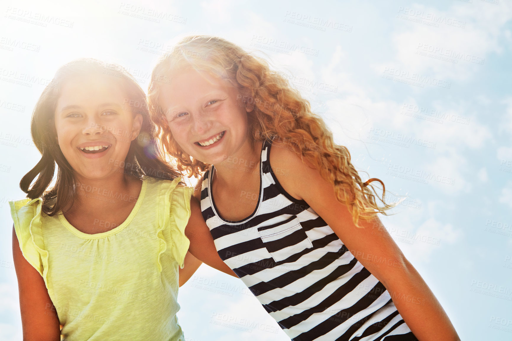 Buy stock photo Portrait, kids smile and girls outdoor with summer holiday, embrace and support for bonding together. Low angle, flare and children hug with care for friendship, vacation and happy on weekend break.