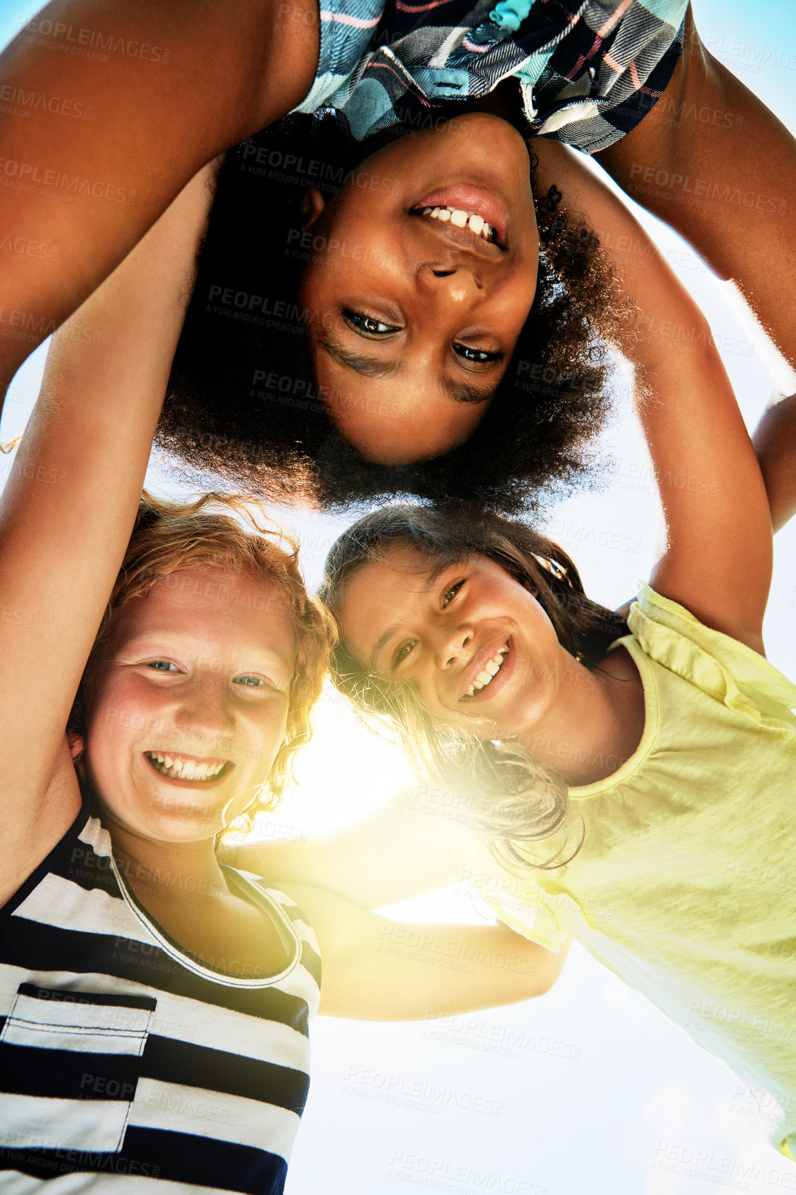 Buy stock photo Happy, low angle and portrait of kids in summer for friendship, playing and fun together. Diversity, youth and girls huddle in circle for childhood, game and smile for school, recess and playground