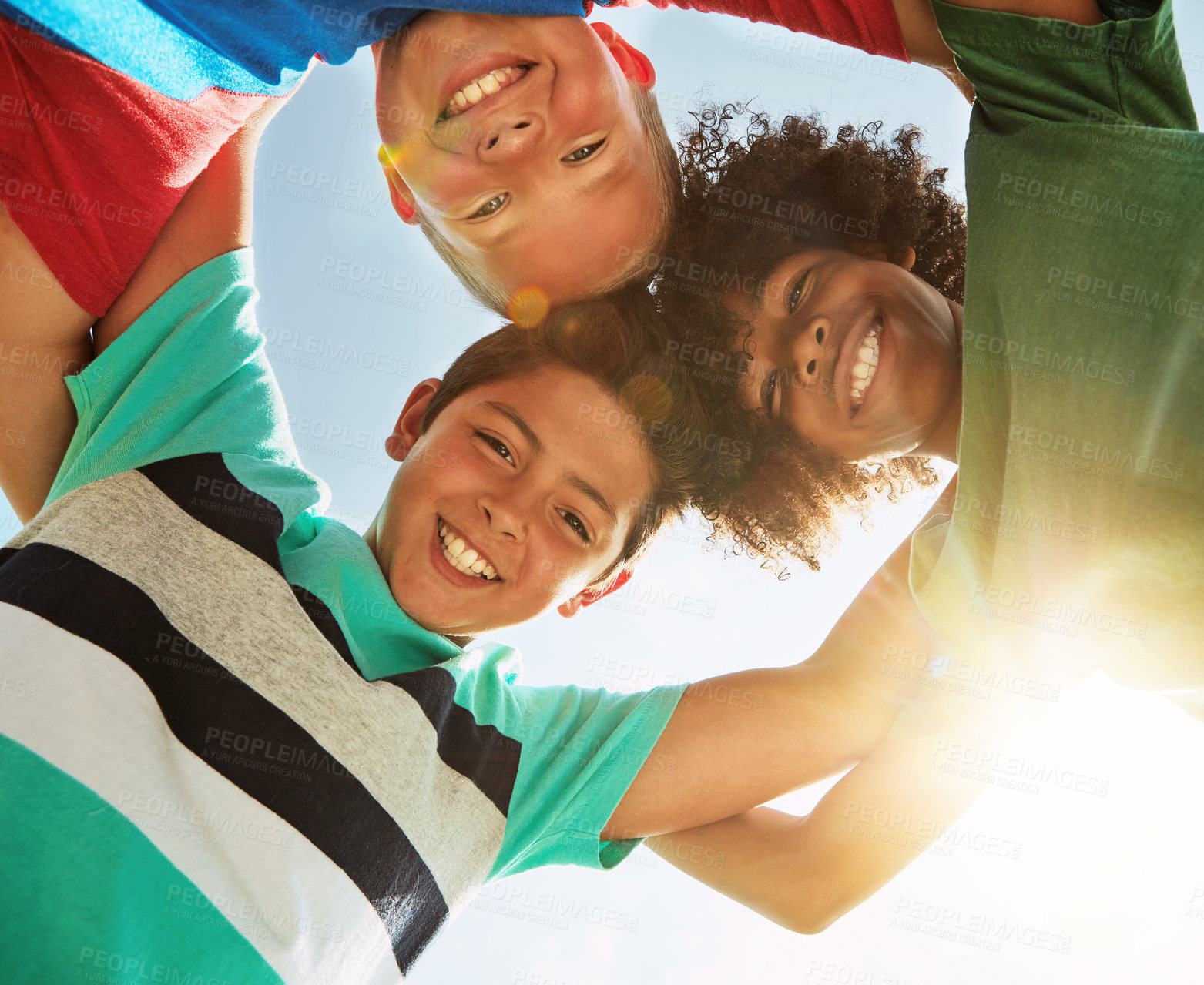 Buy stock photo Happy, low angle and portrait of children in sunshine for friendship, playing and fun together. Diversity, youth and boys huddle in circle for childhood, game and smile at school, camp and playground