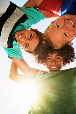 Buy stock photo Happy, low angle and portrait of boys on camp for friendship, playing and fun together. Diversity, youth and children huddle in circle for childhood, game and hug for school, recess and playground